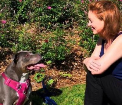 Sandy and Tess smiling at each other